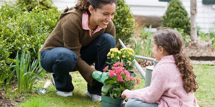 Mother And Daughter Gardening